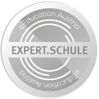 Expert-Schule Logo: Ein Kreis in dem zentral "Expert.Schule" steht. Darüber und darunter steht "eEducation Austria"